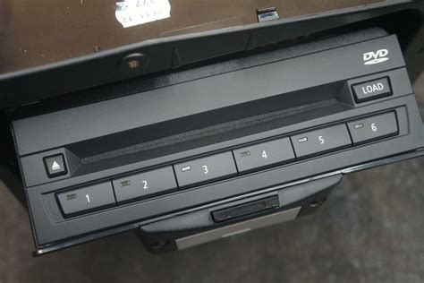 bmw 540i metal box above the cd changer|Glove.